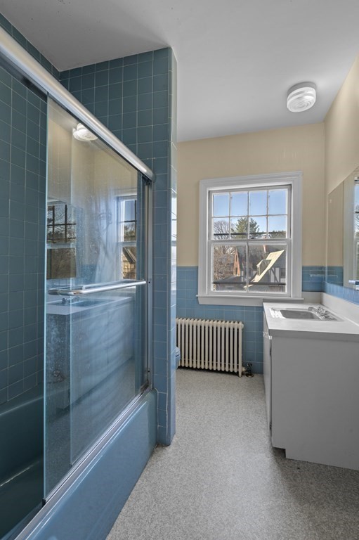 97 Beach Bluff Avenue Swampscott, MA 01907 - Photo 24 of 36 a bathroom with a bathtub and a shower