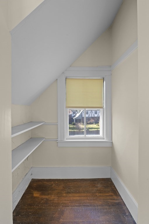 97 Beach Bluff Avenue Swampscott, MA 01907 - Photo 26 of 36 a view of an empty room with wooden floor and a window