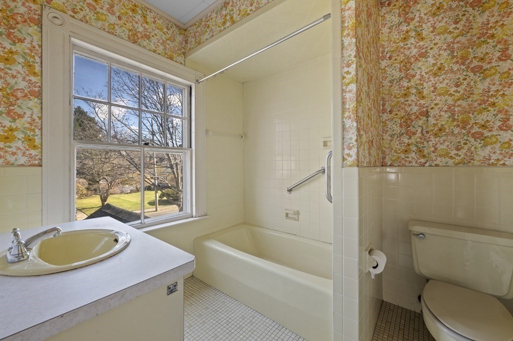 97 Beach Bluff Avenue Swampscott, MA 01907 - Photo 30 of 36 a bathroom with a granite countertop sink toilet and shower