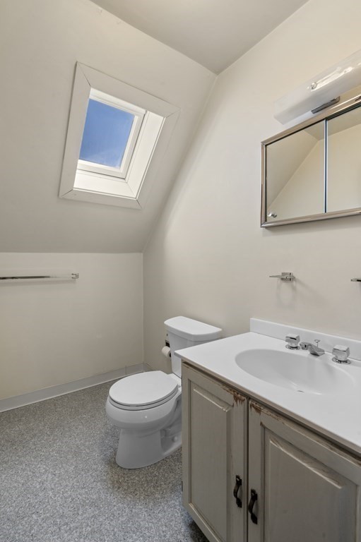 97 Beach Bluff Avenue Swampscott, MA 01907 - Photo 34 of 36 a bathroom with a toilet sink and mirror