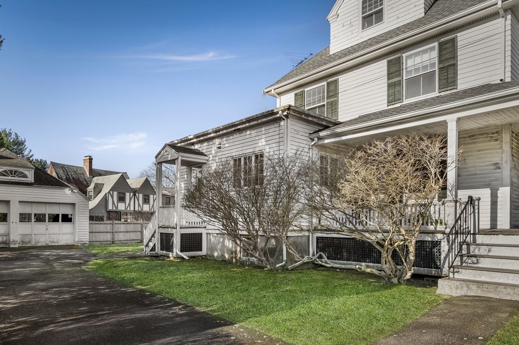 97 Beach Bluff Avenue Swampscott, MA 01907 - Photo 4 of 36 front view of a house with a yard