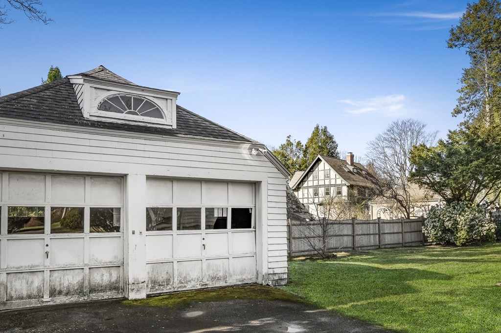 97 Beach Bluff Avenue Swampscott, MA 01907 - Photo 5 of 36 a view of a white house with a yard