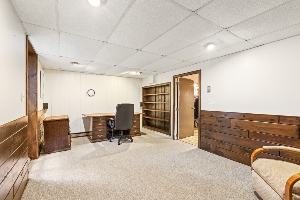 27 Lewis Road Foxboro, MA 02035 - Photo 28 of 40 a bed room with furniture and a chair