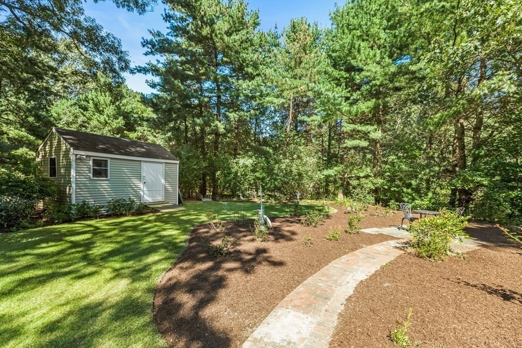 27 Lewis Road Foxboro, MA 02035 - Photo 33 of 40 a backyard of a house with table and chairs