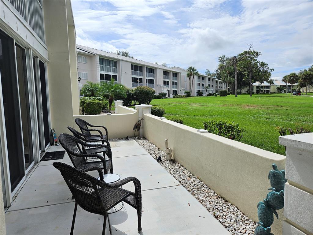 435 Cerromar Lane, Unit 329 Venice, FL 34293 - Photo 13 of 59 a view of outdoor space yard and patio