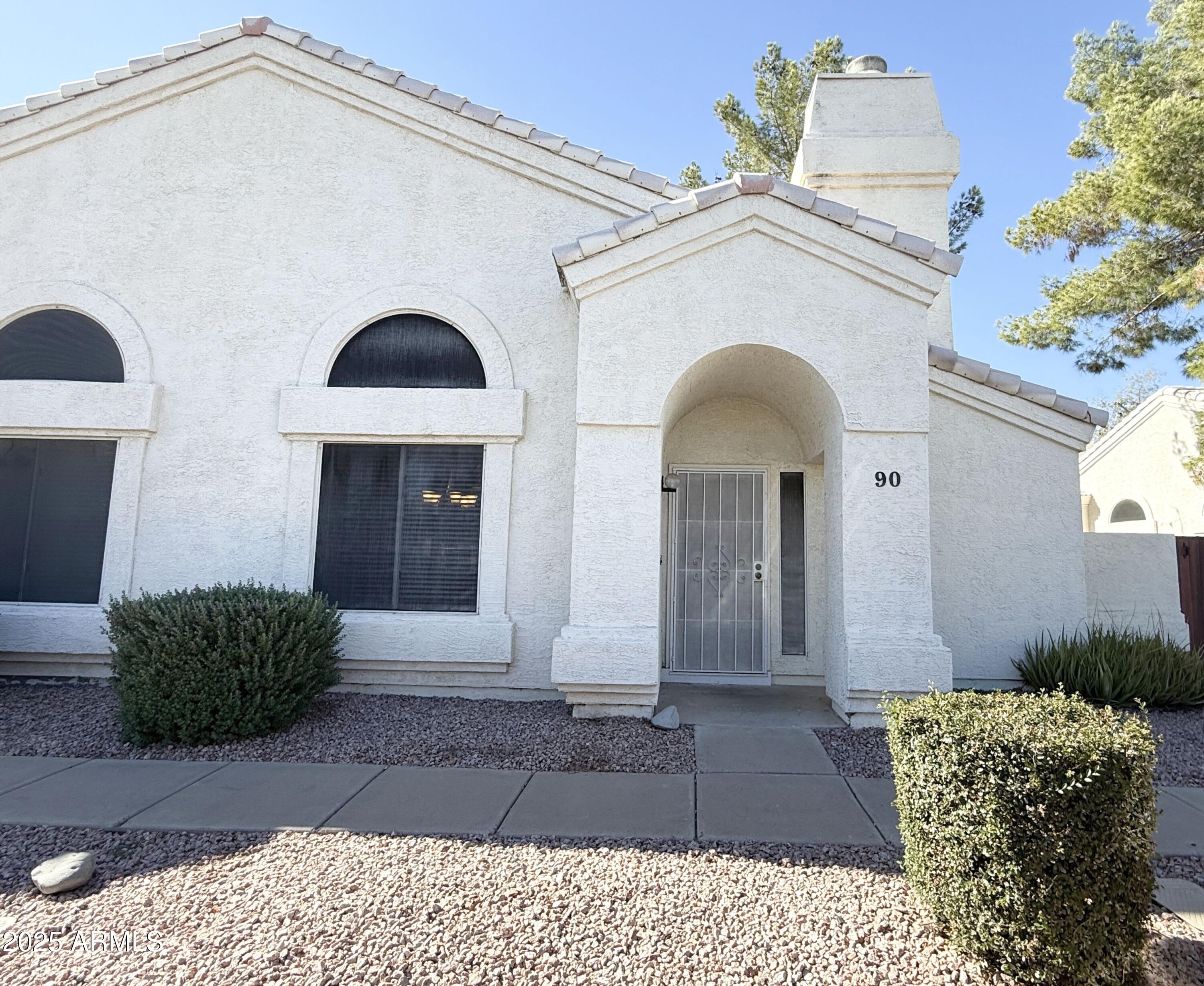 2100 West Lemon Tree Place, Unit 90 Chandler, AZ 85224 - Photo 1 of 24 a front view of a house