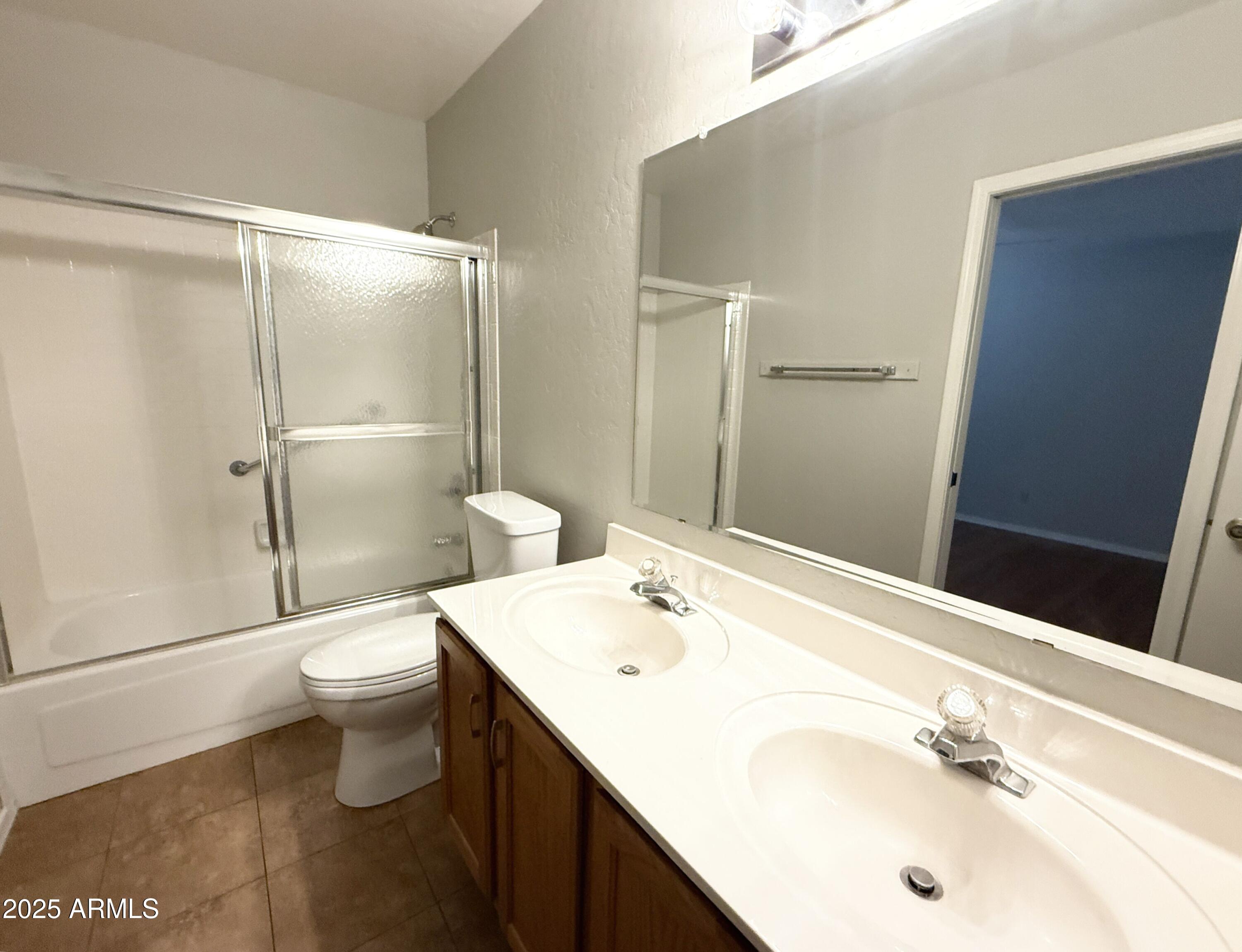 2100 West Lemon Tree Place, Unit 90 Chandler, AZ 85224 - Photo 19 of 24 a bathroom with a sink toilet and shower