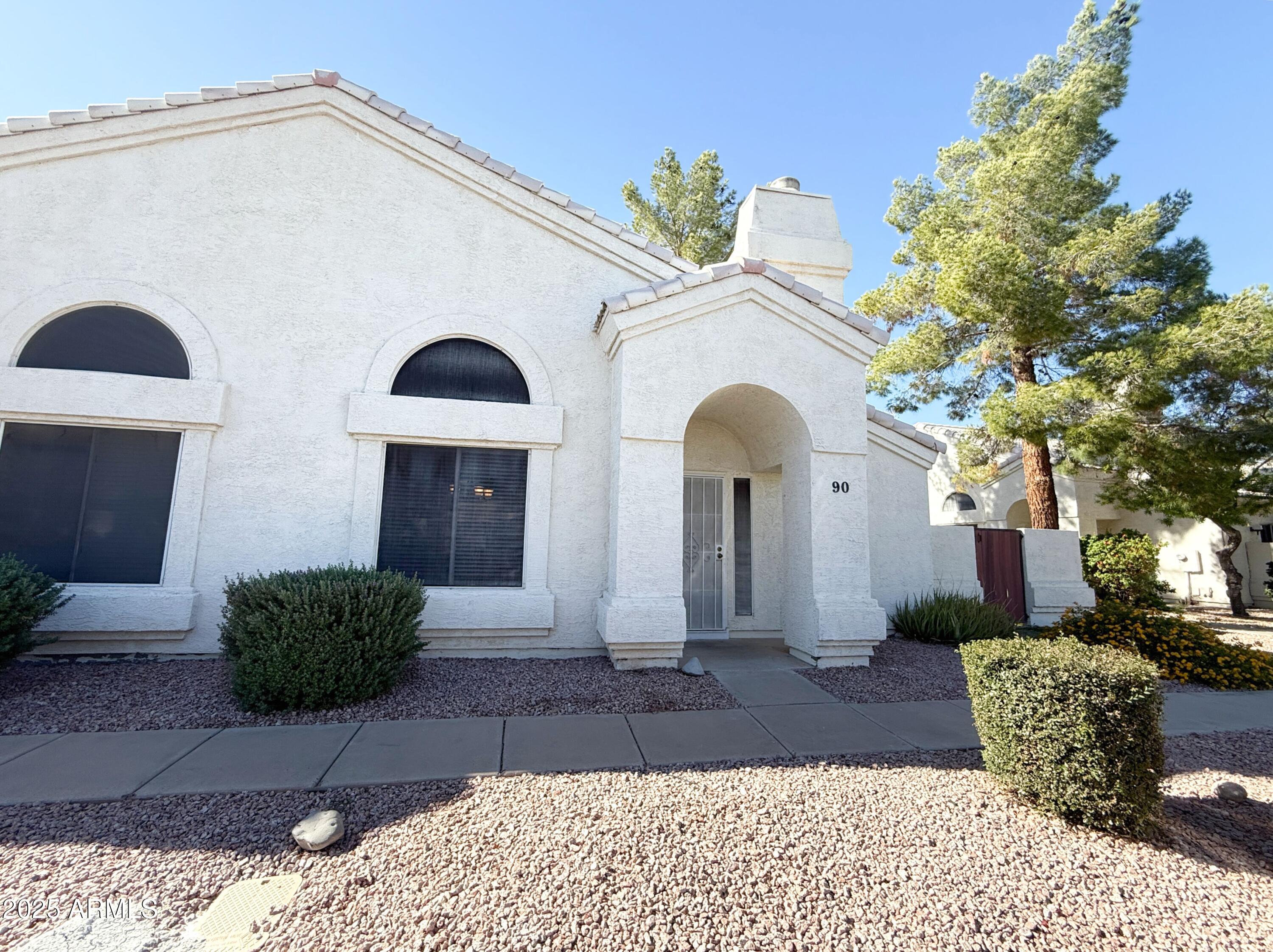 2100 West Lemon Tree Place, Unit 90 Chandler, AZ 85224 - Photo 3 of 24 a front view of a house