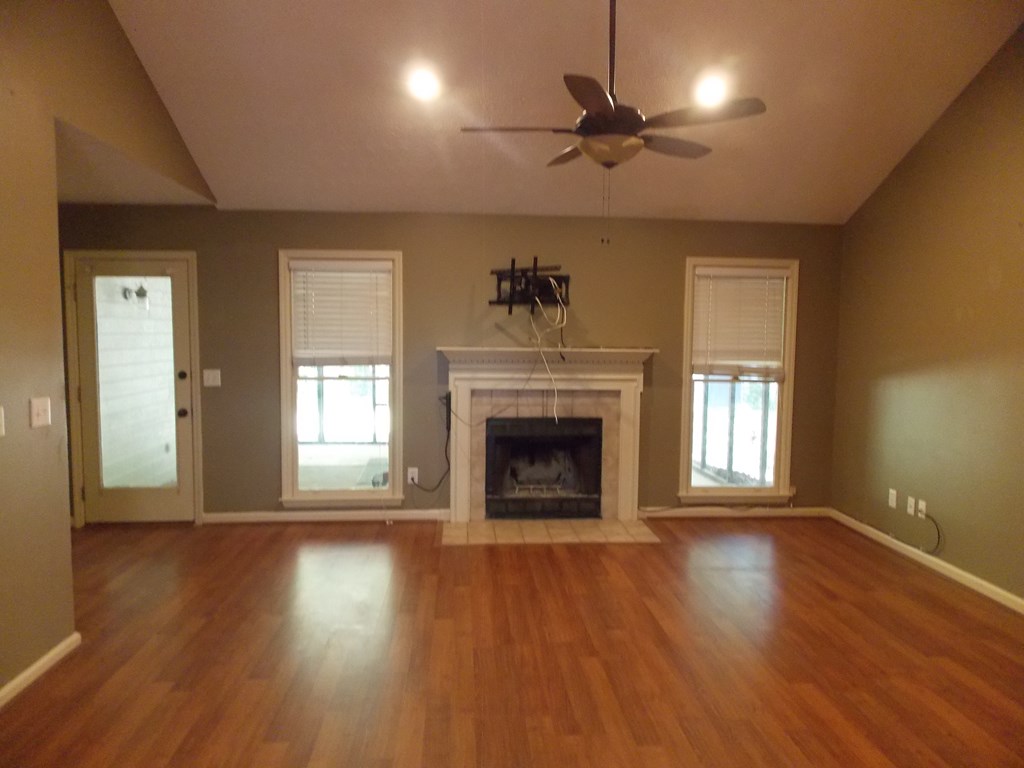562 Evergreen Drive Fortson, GA 31808 - Photo 2 of 9 a view of a livingroom with a fireplace window and wooden floor