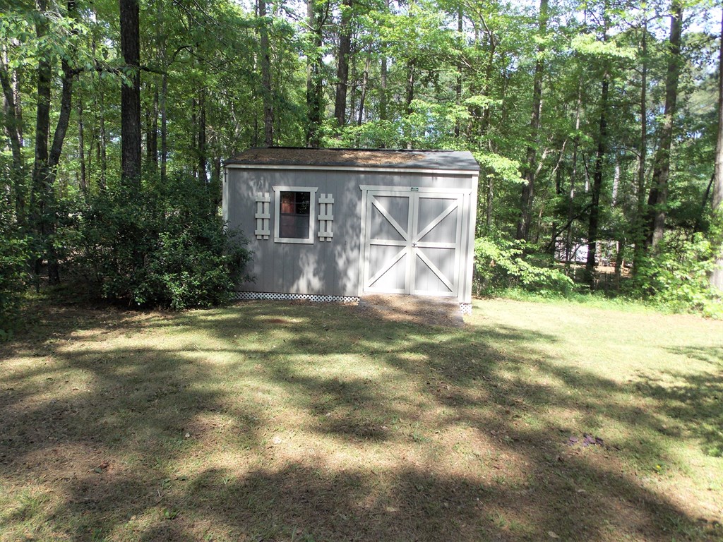 562 Evergreen Drive Fortson, GA 31808 - Photo 9 of 9 a view of house with backyard and garden