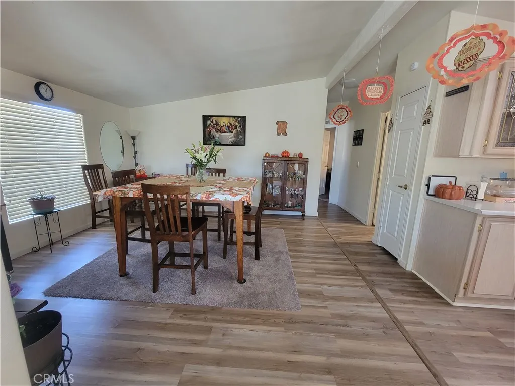 14000 El Evado Road, Unit 43 Victorville, CA 92392 - Photo 11 of 16 a view of a dining room with furniture