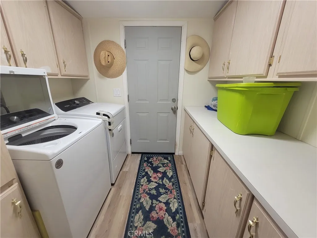 14000 El Evado Road, Unit 43 Victorville, CA 92392 - Photo 12 of 16 a utility room with sink dryer and washer