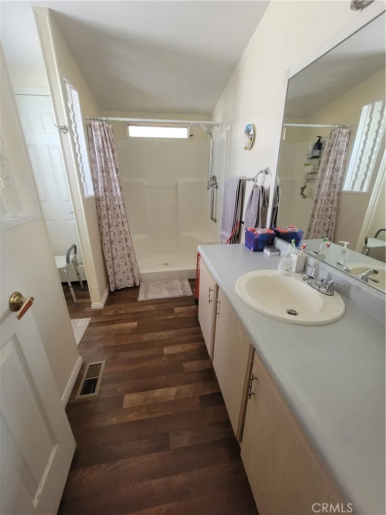 14000 El Evado Road, Unit 43 Victorville, CA 92392 - Photo 16 of 16 a bathroom with sink shower and mirror