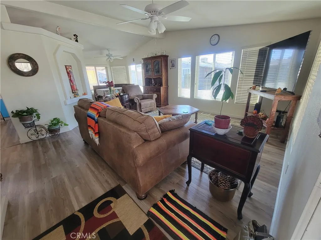 14000 El Evado Road, Unit 43 Victorville, CA 92392 - Photo 5 of 16 a living room with furniture and a flat screen tv