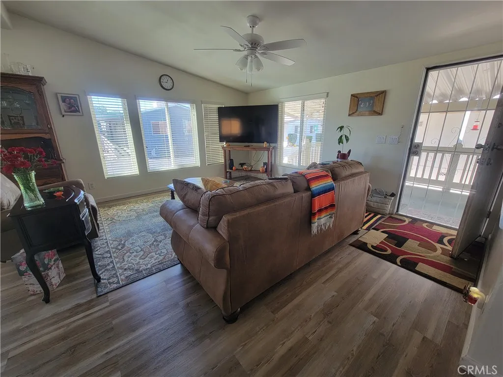 14000 El Evado Road, Unit 43 Victorville, CA 92392 - Photo 6 of 16 a living room with furniture or couch and a flat screen tv