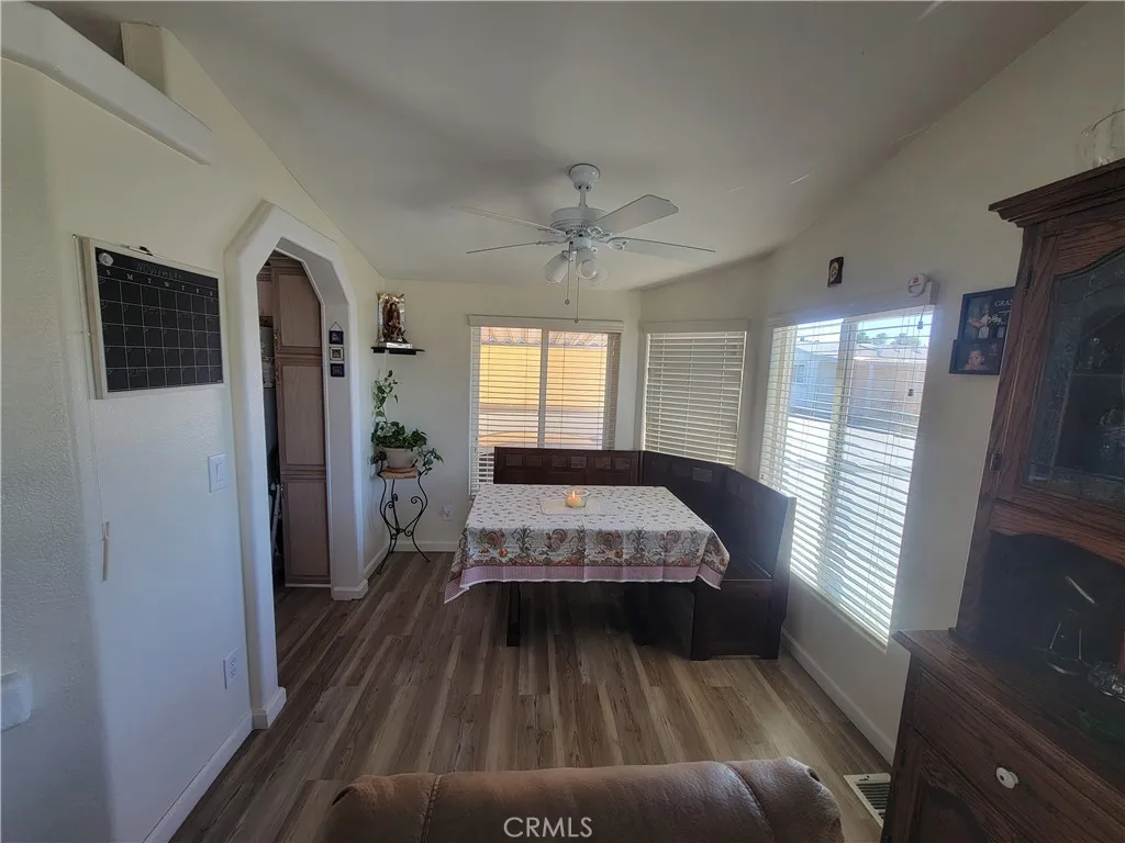 14000 El Evado Road, Unit 43 Victorville, CA 92392 - Photo 8 of 16 a living room with a bed furniture and a large window