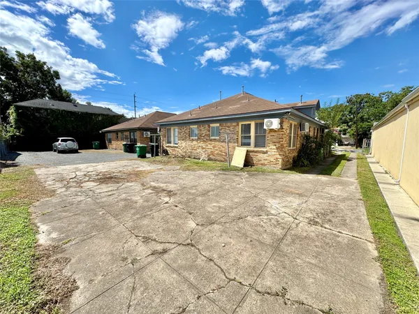 a view of a house with swimming pool and sitting area