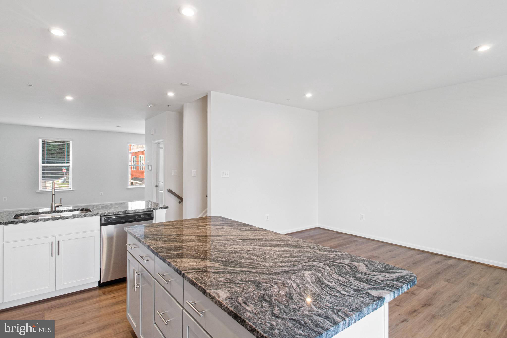 7811 Wolf Run Lane Severn, MD 21144 - Photo 13 of 32 a kitchen with a sink and cabinets