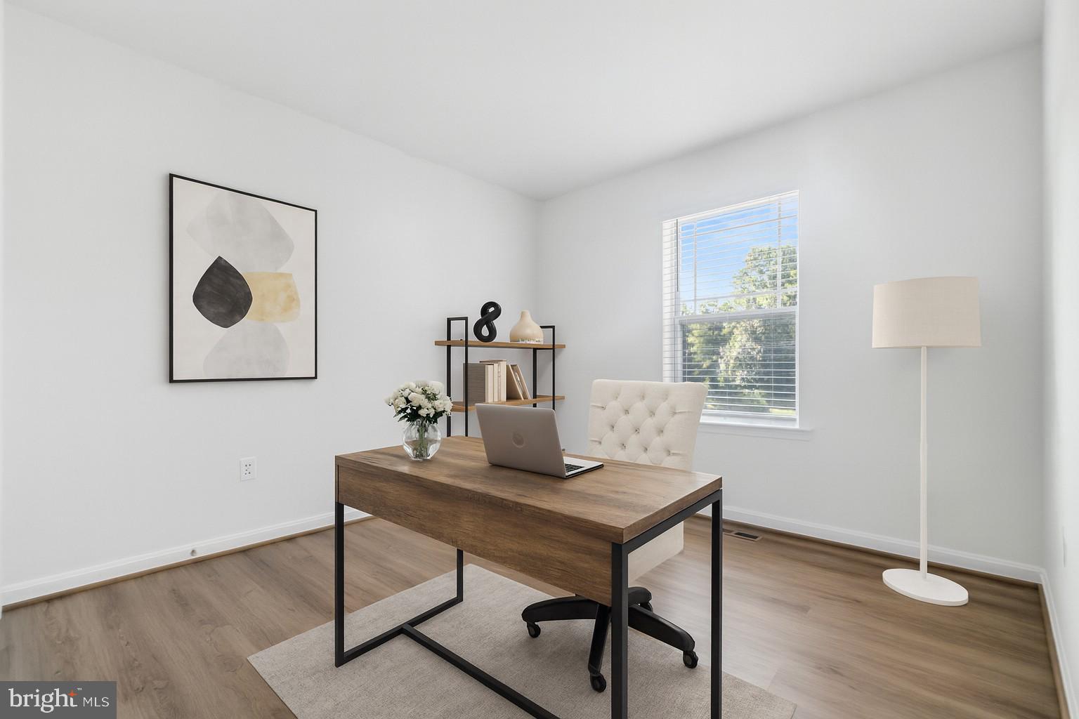 7811 Wolf Run Lane Severn, MD 21144 - Photo 23 of 32 a view of a workspace with furniture and wooden floor
