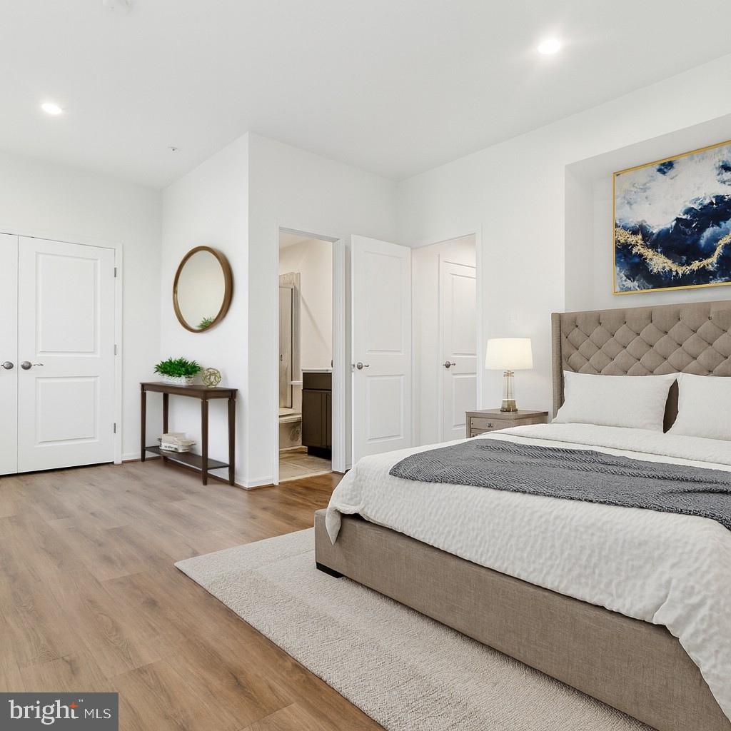 7811 Wolf Run Lane Severn, MD 21144 - Photo 25 of 32 a bedroom with a bed and window