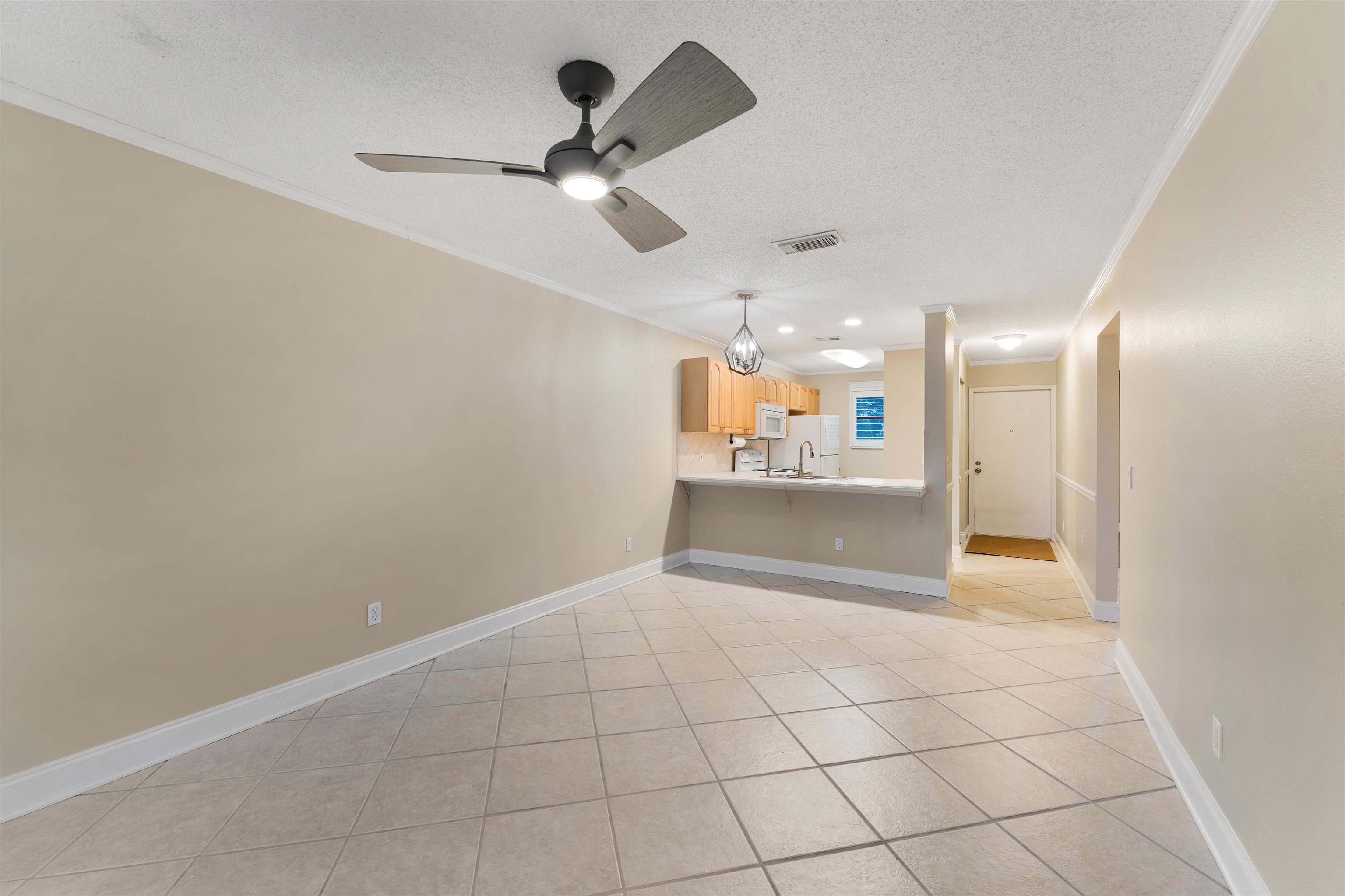 650 West Pope Road, Unit 233 St. Augustine, FL 32080 - Photo 12 of 31 a view of an empty room and a kitchen