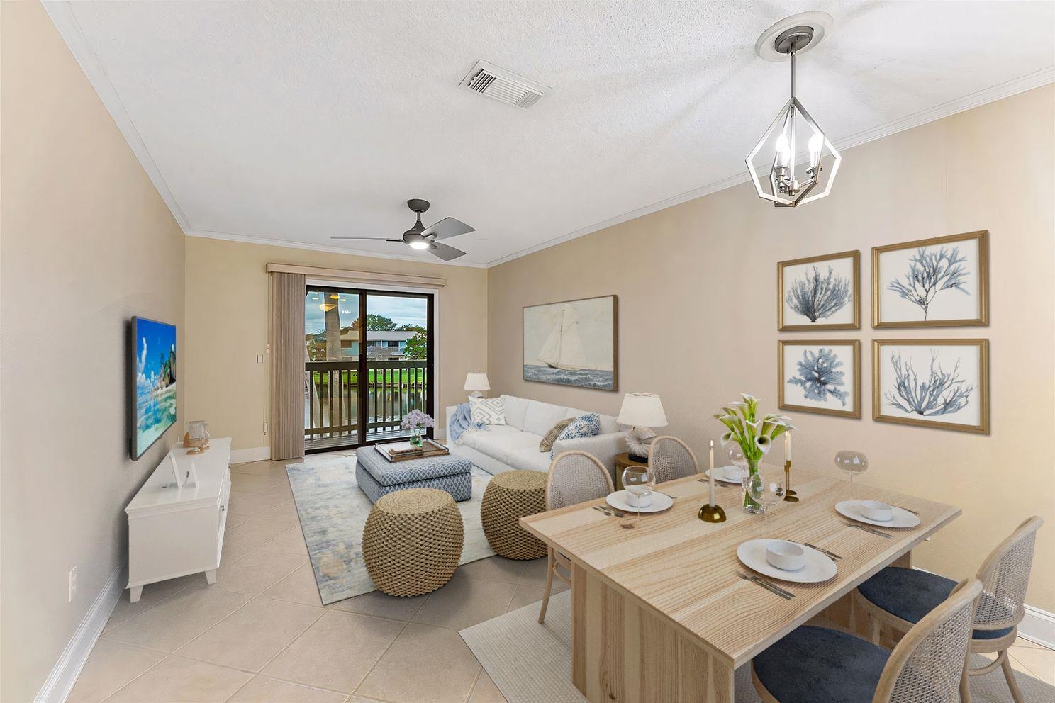 650 West Pope Road, Unit 233 St. Augustine, FL 32080 - Photo 5 of 31 a living room with furniture a window and wall paintings