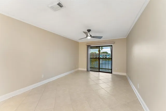 a view of an empty room with a window