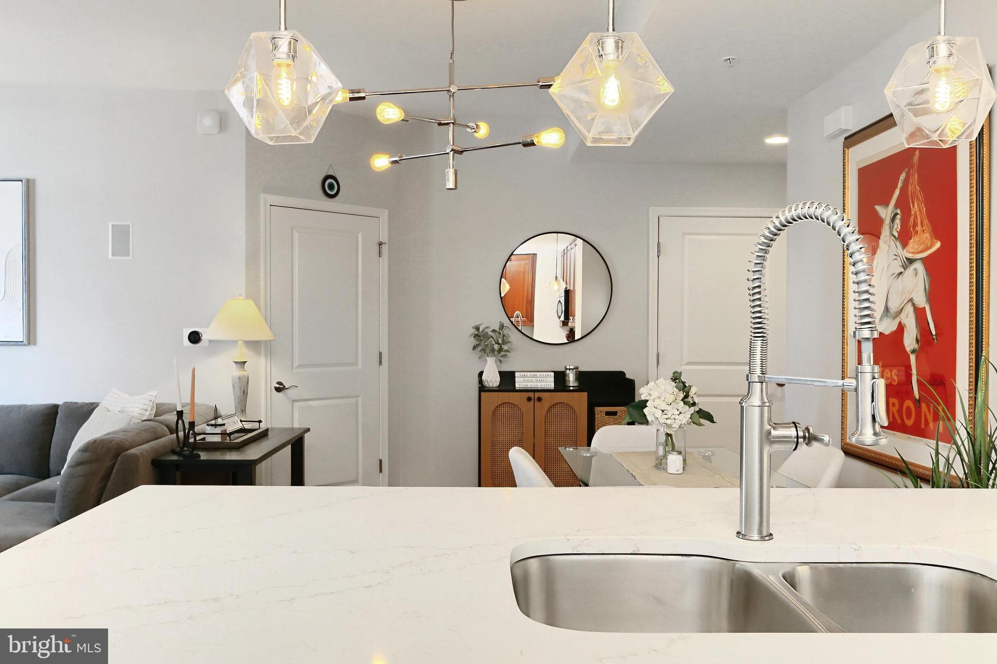 11990 Market Street, Unit 908 Reston, VA 20190 - Photo 10 of 45 a view of a living room and chandelier