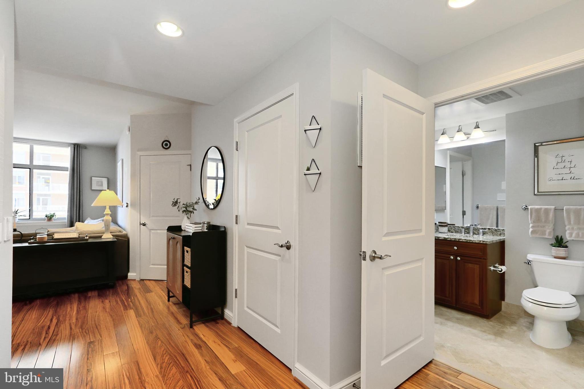 11990 Market Street, Unit 908 Reston, VA 20190 - Photo 2 of 45 a view of living room kitchen with a sink and furniture