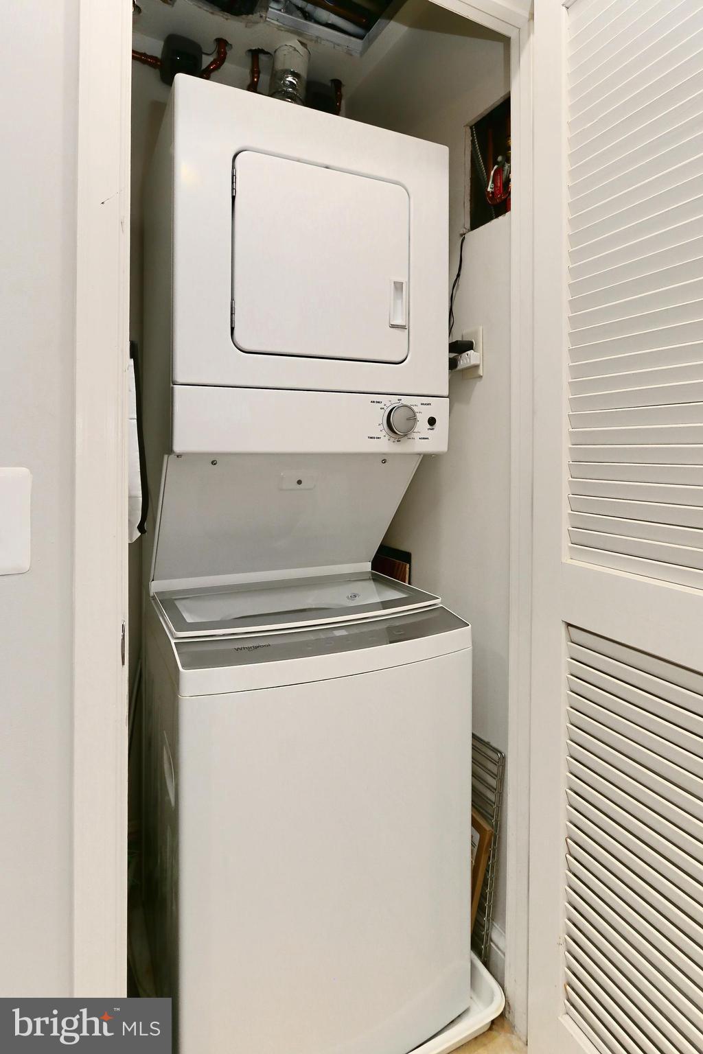 11990 Market Street, Unit 908 Reston, VA 20190 - Photo 18 of 45 a utility room with dryer and washer