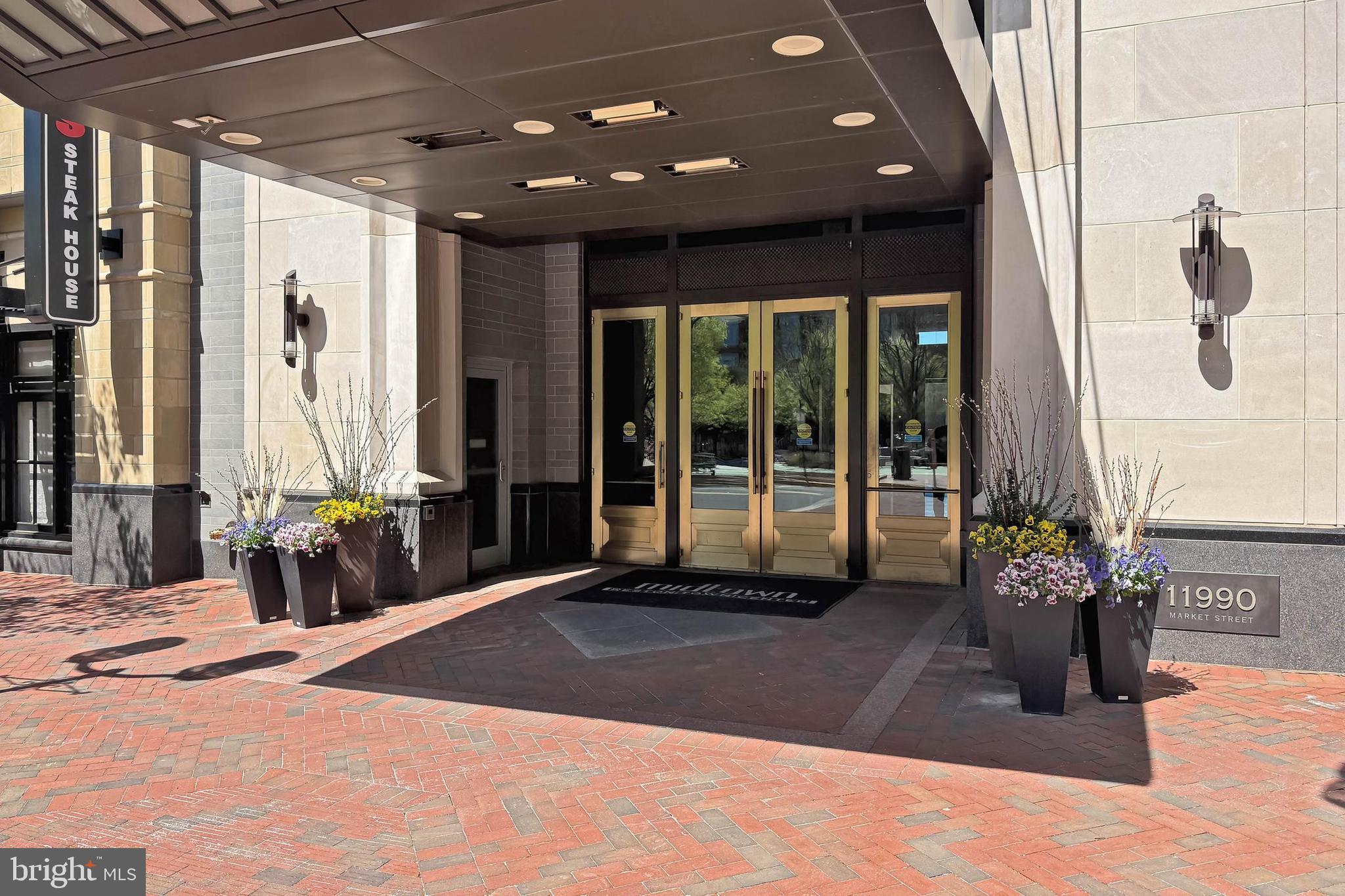 11990 Market Street, Unit 908 Reston, VA 20190 - Photo 26 of 45 a lobby with chair and window