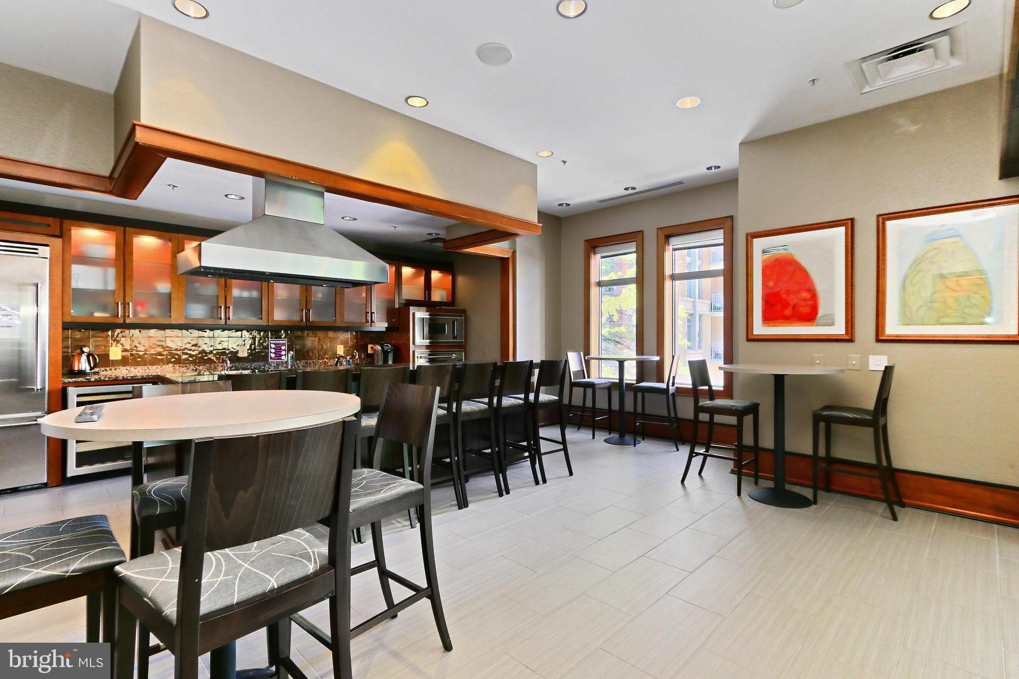 11990 Market Street, Unit 908 Reston, VA 20190 - Photo 34 of 45 a view of a big dining room and livingroom