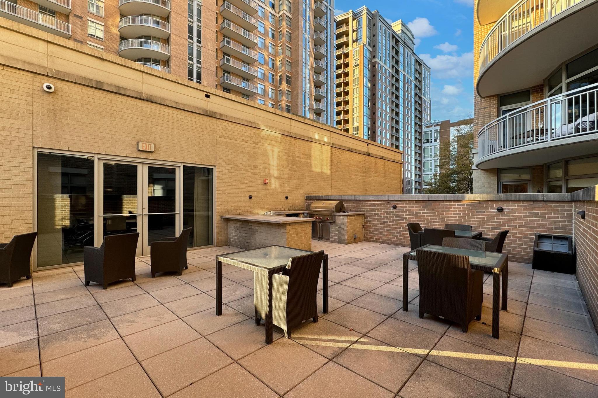 11990 Market Street, Unit 908 Reston, VA 20190 - Photo 40 of 45 a view of a building with outdoor seating
