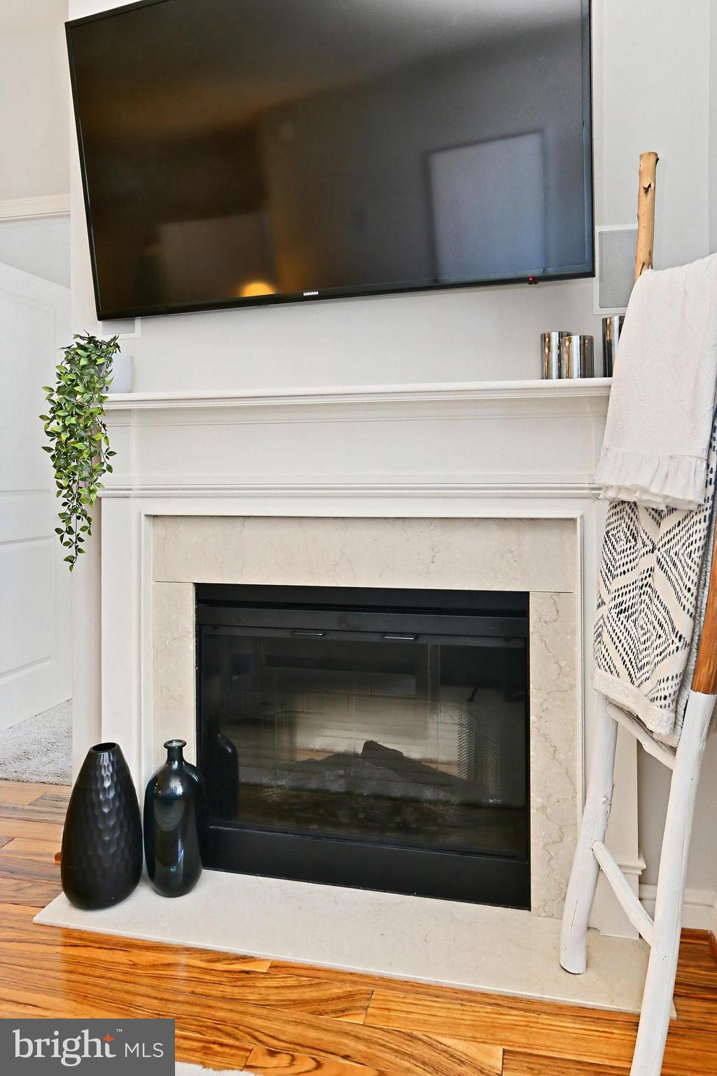 11990 Market Street, Unit 908 Reston, VA 20190 - Photo 45 of 45 a kitchen with a fireplace and cabinets