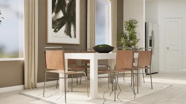 a view of a room with a table and chairs