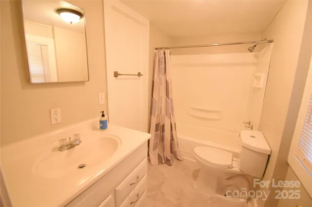 a bathroom with a bathtub and a sink