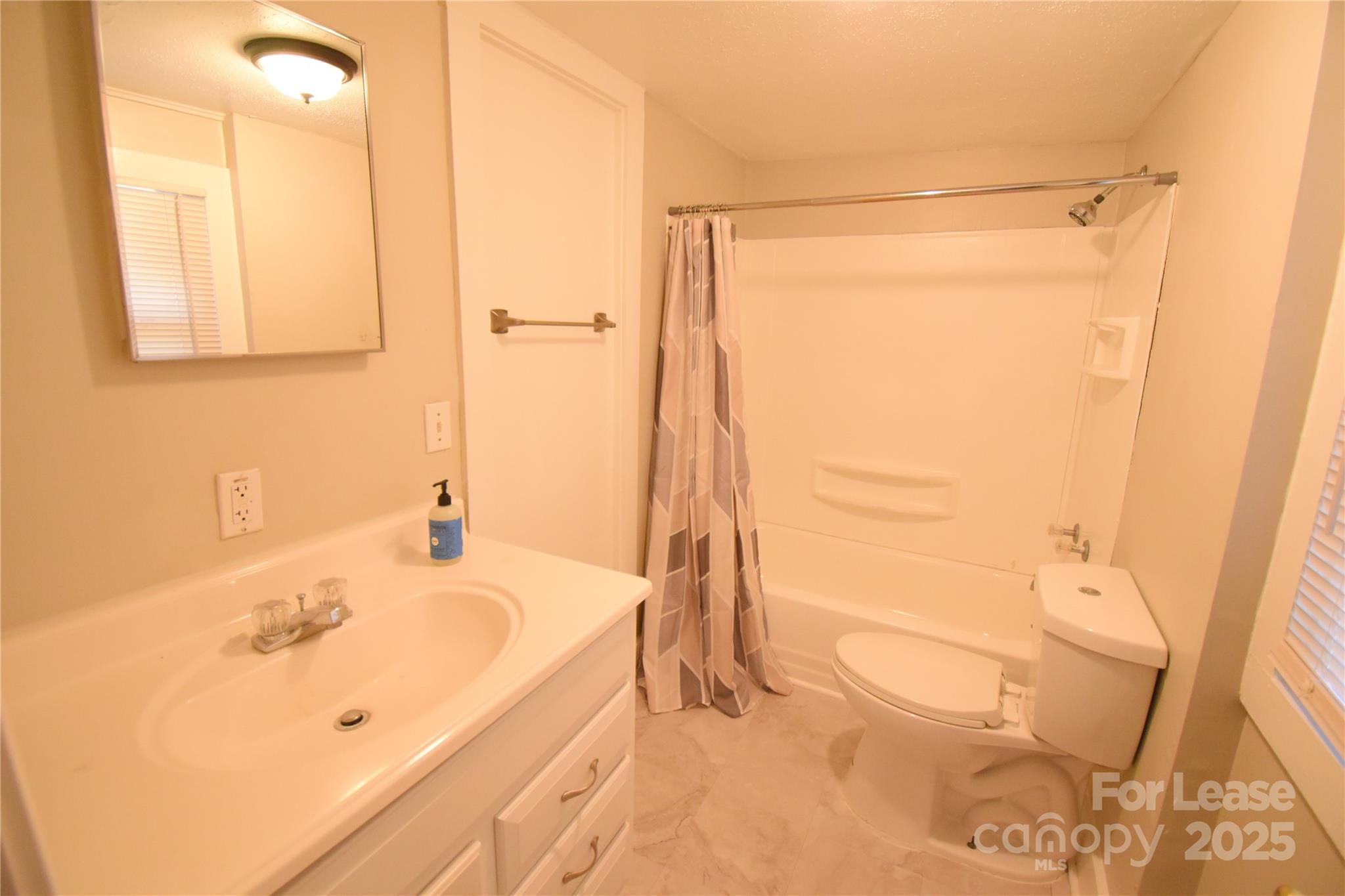 337 Fox Street Southwest Concord, NC 28025 - Photo 13 of 16 a bathroom with a bathtub and a sink