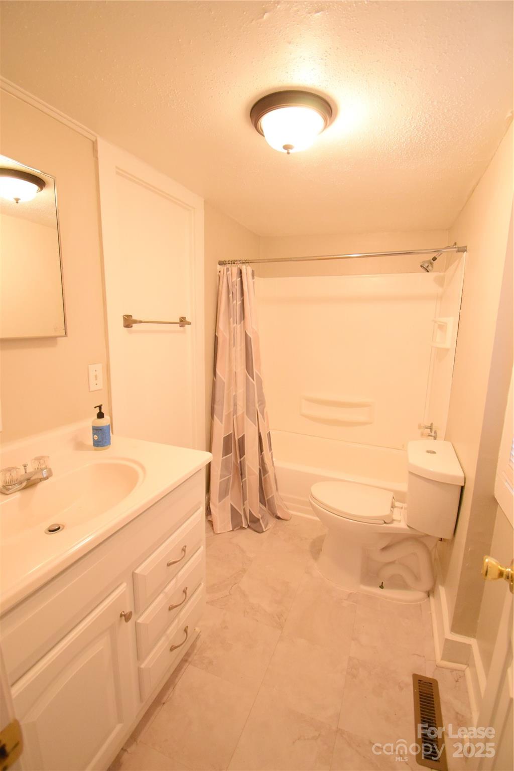 337 Fox Street Southwest Concord, NC 28025 - Photo 14 of 16 a bathroom with a sink and a mirror