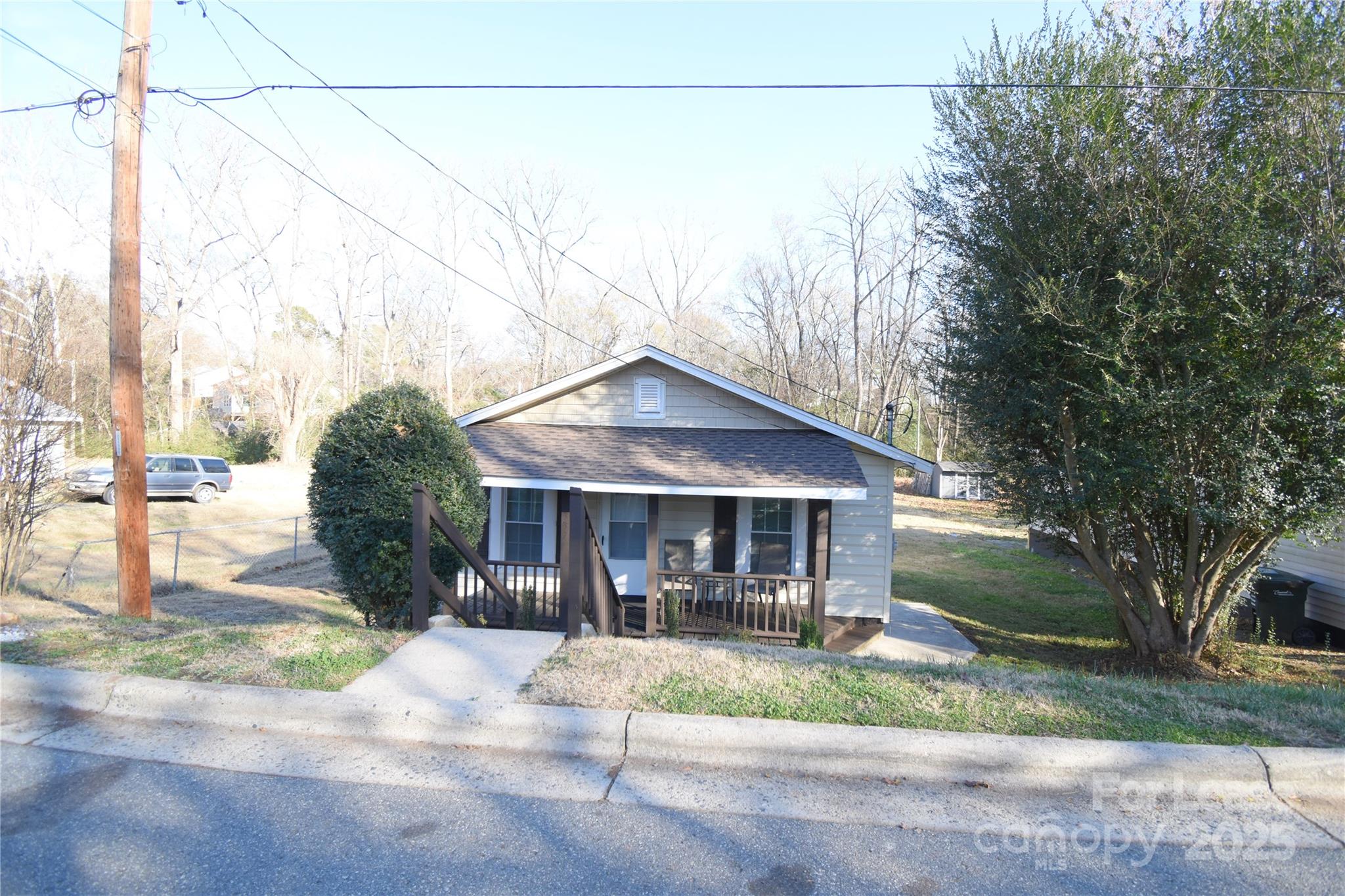 337 Fox Street Southwest Concord, NC 28025 - Photo 2 of 16 a front view of a house with garden
