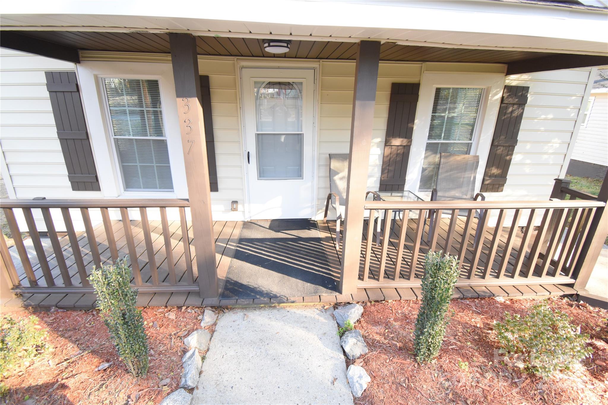 337 Fox Street Southwest Concord, NC 28025 - Photo 3 of 16 front view of a house with a bench