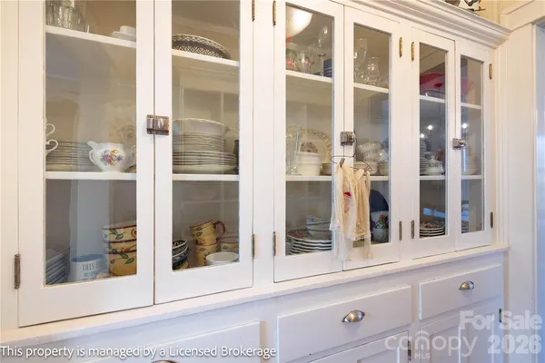 a bedroom with a large bed and a dresser