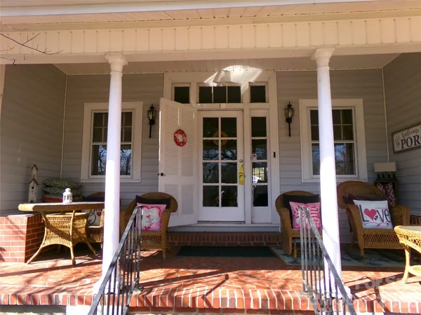 a front view of a house with a porch