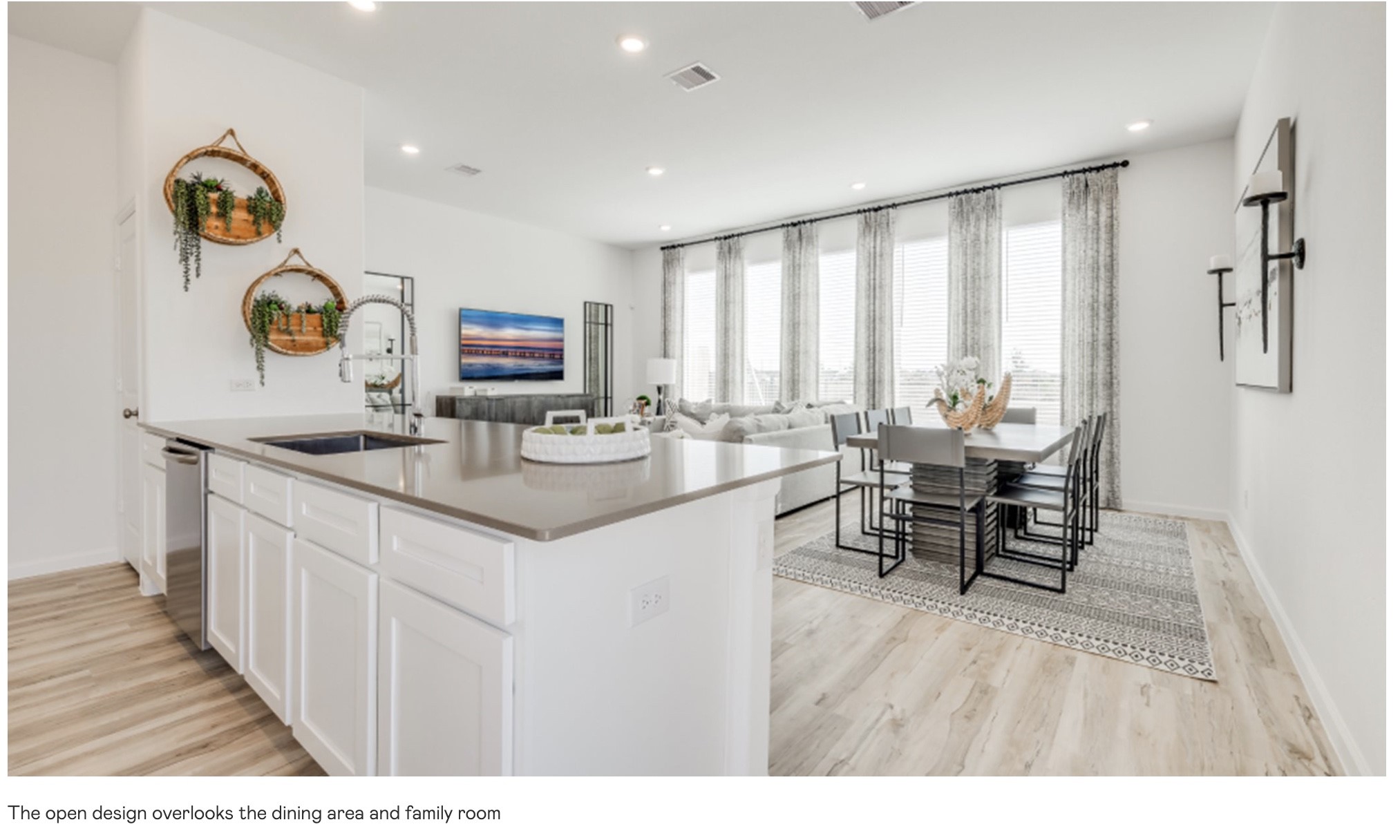 2206 Diagonal Lane Houston, TX 77051 - Photo 4 of 14 a living room with stainless steel appliances kitchen island granite countertop furniture and a wooden floor