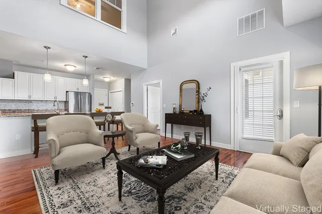 a living room with furniture and a table