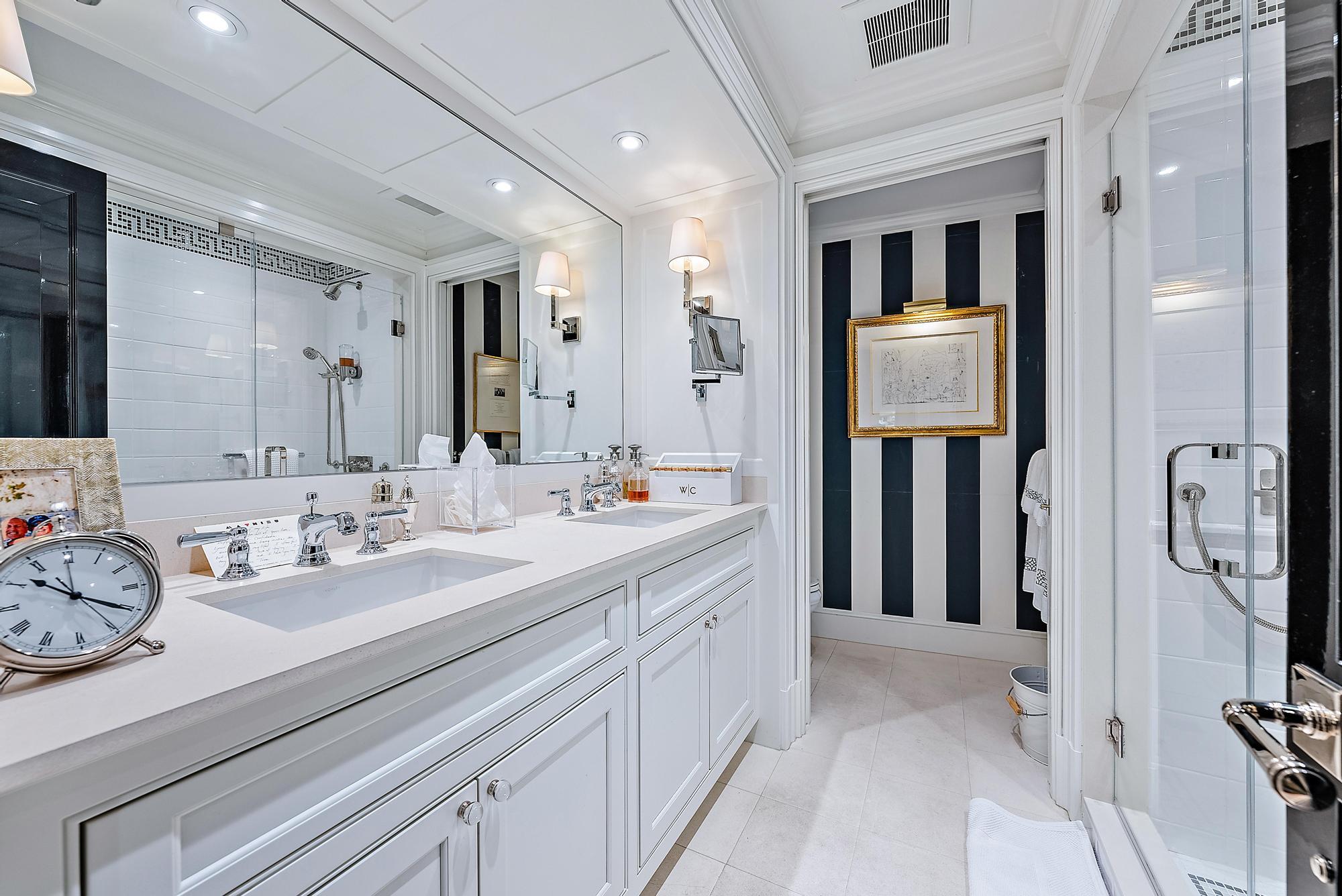 100 Royal Palm Way, Unit F1 Palm Beach, FL 33480 - Photo 13 of 43 a spacious bathroom with a sink and a mirror