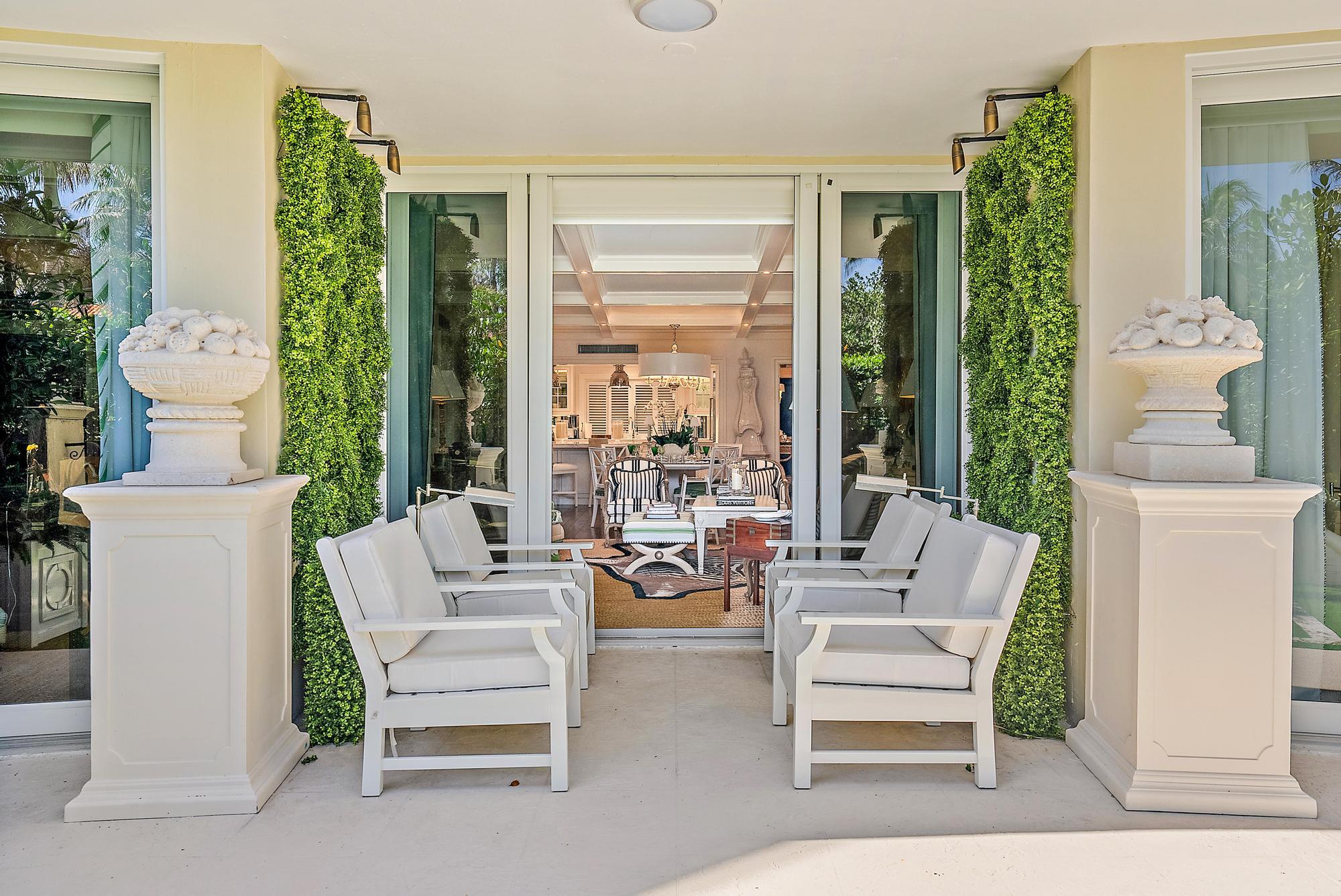 100 Royal Palm Way, Unit F1 Palm Beach, FL 33480 - Photo 31 of 43 a living room with furniture and a large window