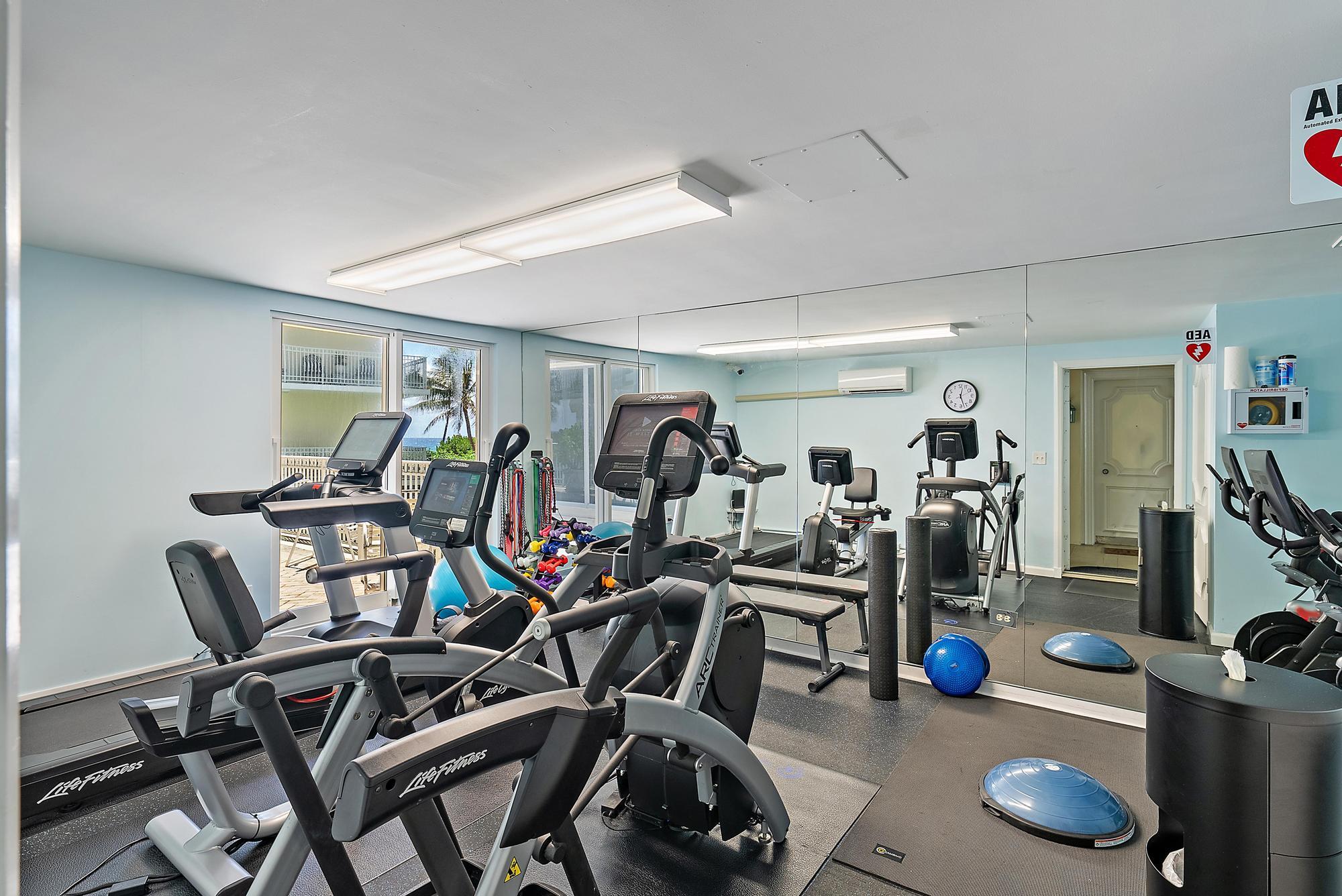 100 Royal Palm Way, Unit F1 Palm Beach, FL 33480 - Photo 35 of 43 a view of a room with gym equipment