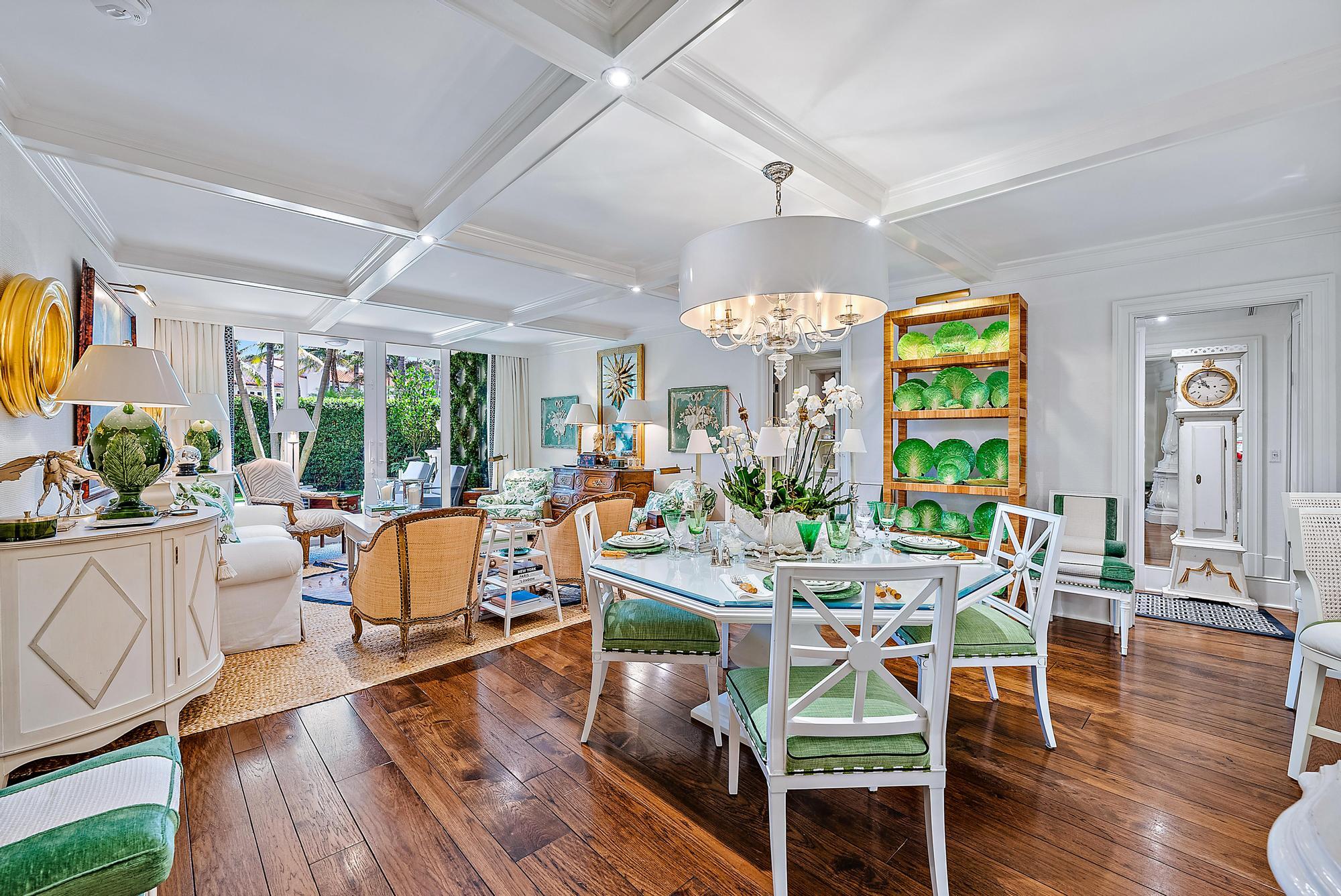 100 Royal Palm Way, Unit F1 Palm Beach, FL 33480 - Photo 4 of 43 a view of a dining room with furniture a chandelier and wooden floor