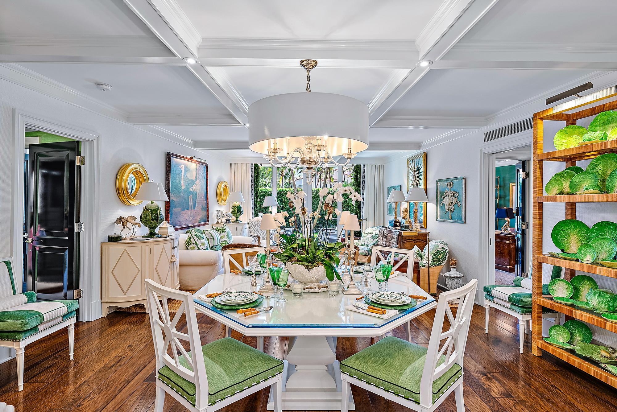 100 Royal Palm Way, Unit F1 Palm Beach, FL 33480 - Photo 5 of 43 a view of a dining room with furniture a chandelier and wooden floor