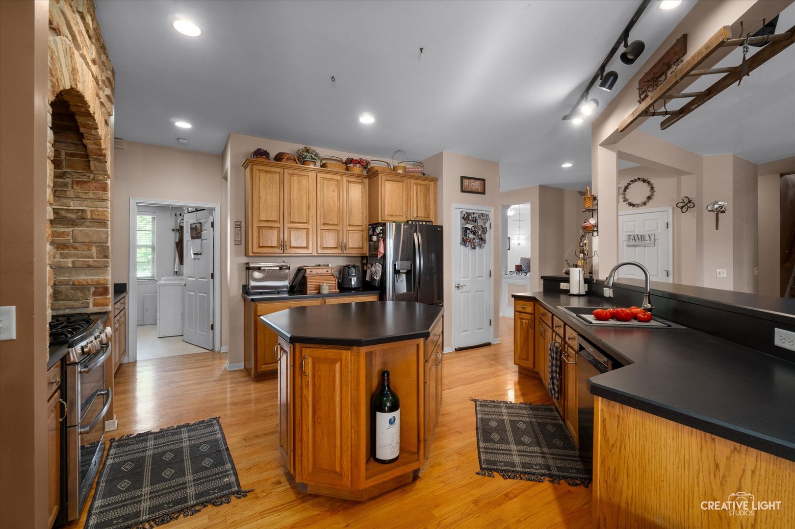 1750 Little Rock Road Plano, IL 60545 - Photo 13 of 33 a kitchen with stainless steel appliances granite countertop a refrigerator and a stove
